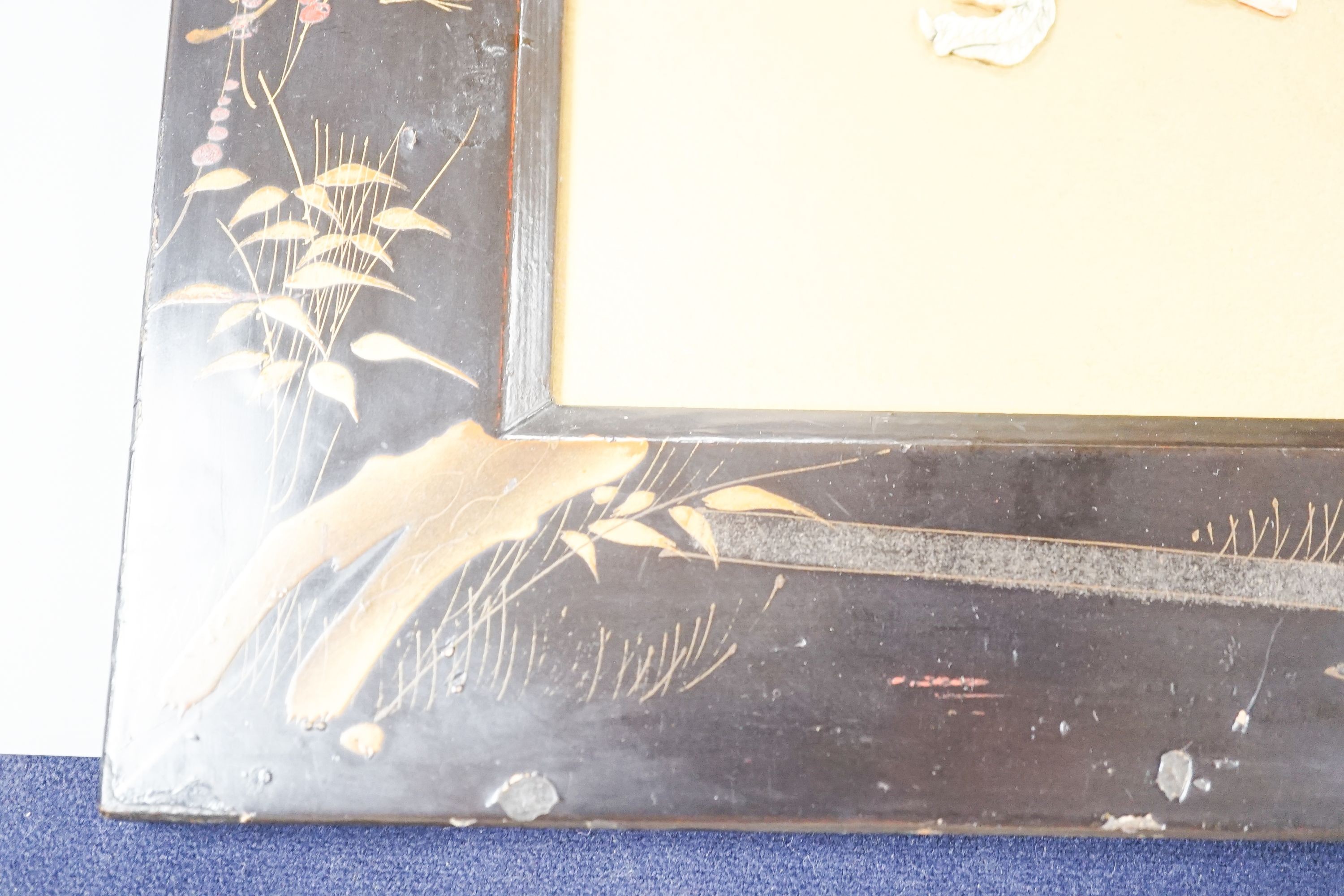 A Japanese bone ‘dragon’ and lacquer framed panel, early 20th century, 31 x 37 cm